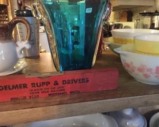 A collectible level with Pyrex and Hazel Atlas dishes. 