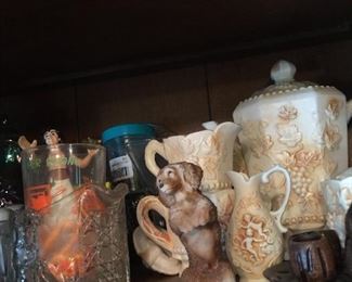 A posing pup among studio-made ceramics. 