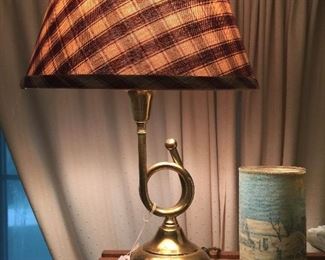 A brass-finished horn lamp. 