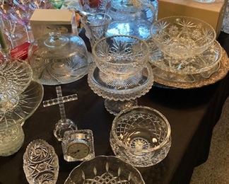 Tables Full of cut glass bowls, dishes and servers.