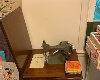 Vintage Westinghouse Sewing Machine with wood cabinet. 