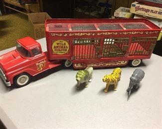 Buddy L wild animal circus metal truck and trailer. All 3 animals, plastic windows, clear plastic top in trailer and cage doors here. Nothing missing and the paint on the metal is in exceptionally great condition.