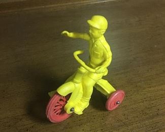 Boy on tricycle by Auburn Rubber Company