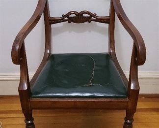 Regency Period English Carved Arm Chair

Hand carved with leather seat, seat has splits.  Nice chair measuring 35" tall