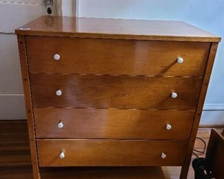 Mid Century Modern Fritz Bauder Wood Dresser

Designed and made by Fritz Bauder of Miller Manufacturing of Richmond Virginia

Mid-Century.  Solid wood with 4 drawers.  Good condition with some ware and crazing of glaze.  Preview for further details/condition

Measures 34" wide and 34" high