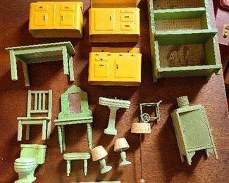 Lot  Antique German American Doll House Furniture 
1.3 metal gold & blk kitchen stove, sink, hutch
2. Small green metal tea cart out of scale
3. deco vanity with mirror and kidney bench
4. toilet, sink and bathtub metal fixtures
5. kitchen table one chair 
6. Wood refrigerator with open door mk Germany 5"
7. Large scale green wood hutch 8.25" h.
8 2 matching wood lamps green cream and gold
9 floor lamp wood and metal