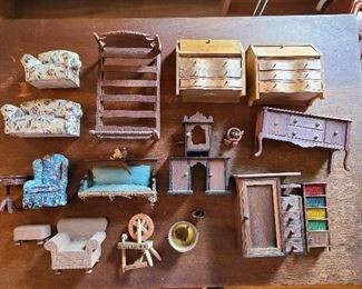Japanese American German Doll House Furniture 
1. 2 matching desks 1930's wooden 4.25" h.
2. Wood buffet
3. Etagere missing shelf
4. Spool bed  6.50" l. 
5.Brass bucket coal and potted plant
6. Shelf with faux books
7.Wardrobe with drawers
8. End table Colonial style
9.Faux fabric wooden tufted chair and matching stool
10. Japanese fabric sofa and chair
11.Cardboard fabric wingback stuffed chair
12.Victorian Settee one leg missing one broken
13. Souvenir of chimney rock nc. Spinning Wheel
All pieces have been played with preview for condition