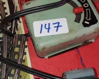 
Vintage toy train set by German company Dienst.  Original box and contents including booklets, track, cars etc.  Batteries are old and may not be removeable from the battery box.
Box has tares/flattening.

Preview for condition and contents. Unknown if working
