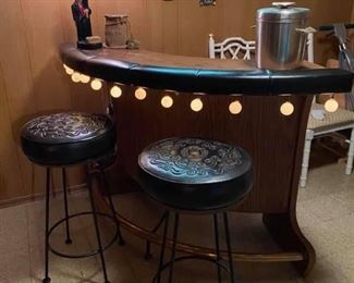 MCM 1960s curved bar with 2 black “leather?” Stools. Would fit nicely in a corner. 