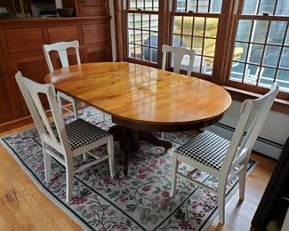 Table with Three Leaves and Four Chairs
