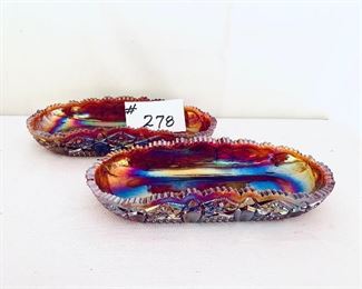 Red carnival glass trays. 10.5” L 
Pair $48