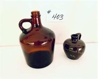Brown glass jug and  smoky mountain jug Cornelison Pottery 
Lot $25 FIRM