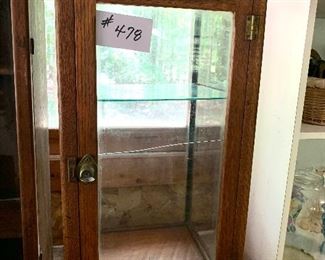 Glass display cabinet. 
See photos for damage. 
14w 14.5 d 26t    $125