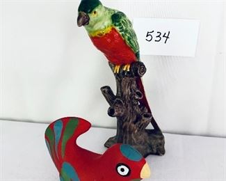 2 parrots —small red ceramic 5.5 inches wide tall ceramic on tree 9 inches tall 
$25 each