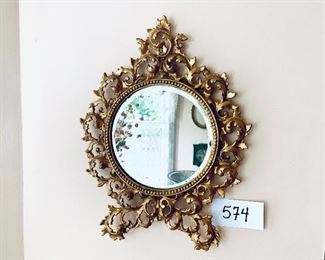 Small ornate metal framed mirror
12 inches wide 17 inches tall $99