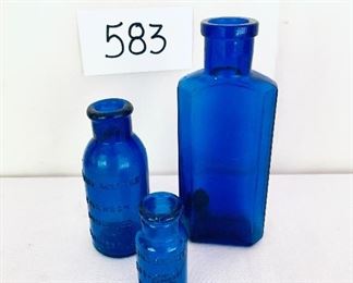 Three cobalt medicine bottles 2 to 6 inches tall $32