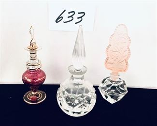 Three perfume bottles 5 to 6 inches tall $35