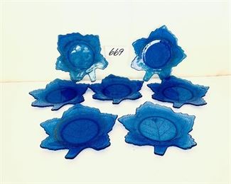 Set of seven blue glass leaf plates 
some gold loss 8 inches wide $60