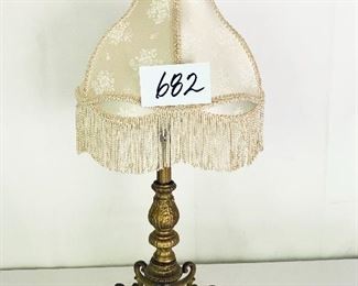 Brass lamp with fringe shade
 it works 26 inches tall $99