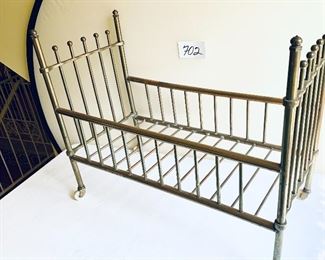 Brass doll bed on casters 12w. 25t 
$75