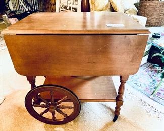 # 760. 
Vintage tea cart. 39 w 21L 28t.  Light scratches on the top.    I would be so cute painted. $225