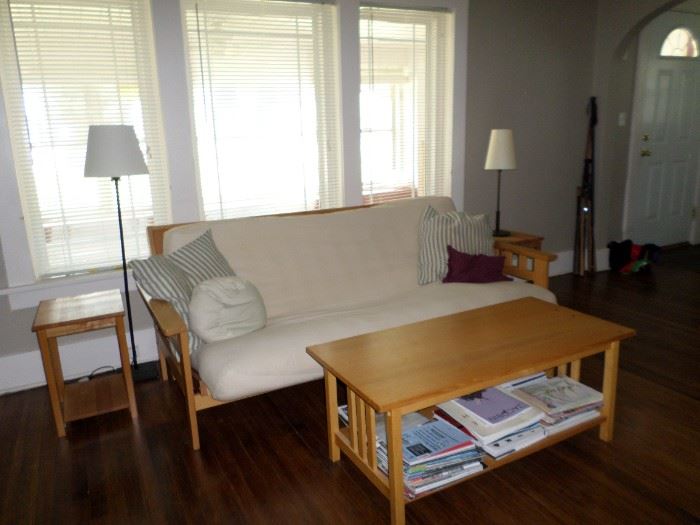 Matching futon, coffee table, end tables.