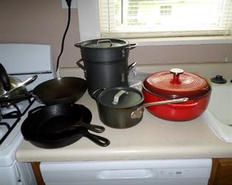 Lodge dutch oven and skillets.