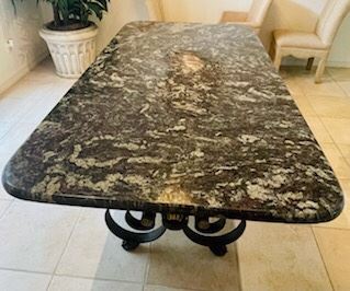 $1,100 - Italian or French style table Granite top and iron base 7'L x 42 1/4"W - Granite thickness 1" located at different location 