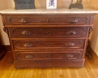 Renaissance Chestnut Marble Top Chest of Drawers. Drawers have applied molding and fig carved pulls.
