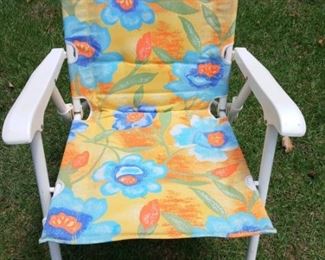 Lot Number:	70
Lead:	Colorful Plush Cushion Lawn Chair
Description:	white metal; folding; seat 18" by 18"