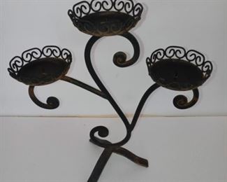 Lot Number:	72
Lead:	Wrought Iron Candle Stand
Description:	holds 3 candles; 15" tall by 13" wide