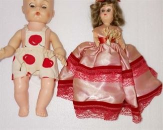 Lot Number:	85
Lead:	Two Vintage Dolls
Description:	baby w/ apple pants; eyes open and close; plastic 8" tall girl in pink dress- eyes open and close; hard plastic; 6" tall
