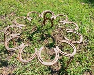 Lot Number:	169
Lead:	Horseshoe Sculpture
Description:	made from real horseshoes; 23" diameter by 10" tall slightly slanted top
