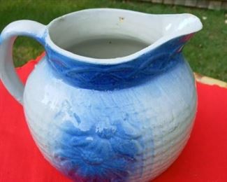 Lot Number:	177
Lead:	Blue Pottery Pitcher
Description:	daisy flower design; 6.5" tall at spout by 7.5" wide shorter than usual pottert pitchers
