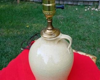 Lot Number:	178
Lead:	Pottery Jug Lamp
Description:	brass lamp parts; works 13" to top; 6.5" diameter at center