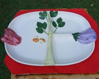 Lot Number:	182
Lead:	Ceramic Vegetable Platter
Description:	Portugal; signed; #863 eggplant & pepper on sides serve as hand grip 16" long by 10" wide
