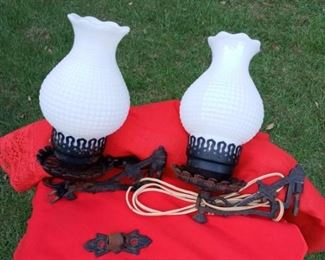 Lot Number:	191
Lead:	Vintage Pair of Wrought Iron Lamps
Description:	wall bracket lamps; swivel; milkglass/ hobnail glass shades; one wall bracket broken by bottom screw hole