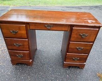 Lot Number:	207
Lead:	Vintage Wooden Desk
Description:	2 column; original pulls 43" wide by 23" tall by 16" deep
