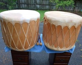 Lot Number:	208
Lead:	Large Drums- End Tables
Description:	rawhide tops & bottoms; wooden circular surface 1= 26" diameter & 1= 27" diameter (both 19" tall) shape of drums are not exactly alike; 1 has 1 piece of rawhide broken on lower side (see pictures); not perfectly round; 2 drumsticks
