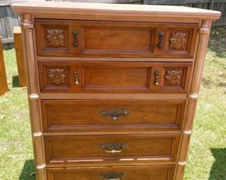 Lot Number:	210
Lead:	Mid-Century 5 Drawer Chest
Description:	carved posts, teardrop pulls, beveled edges, applied carving to top of drawers; 51" tall by 38" by 20"
