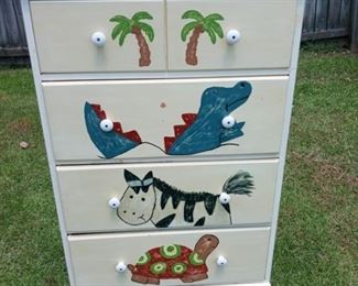 Lot Number:	217
Lead:	4 Drawer Wooden Chest
Description:	painted on animal characters; beveled top 74" tall by 28" by 17.25"