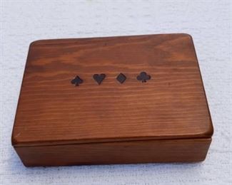 Lot Number:	219
Lead:	Wooden Playing Card Box
Description:	holds 2 decks, knob feet on bottom; 4 card suites are engraved on top 6" by 4.75" by 2"

