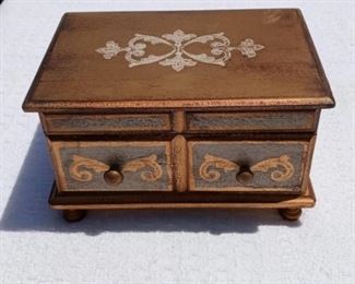 Lot Number:	220
Lead:	Wooden Jewelry Music Box
Description:	frosted design on top & front; works 8.5" by 6" by 5"
