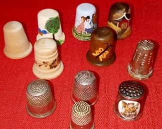 Lot Number:	244
Lead:	Vintage Thimbles
Description:	11 total 6 wooden: 4 hand painted, 1 etched & 1 plain 5 silverplate- 1 1993 Hummel 1st edition, 1 Germany, 1 England & 1 hand hammered