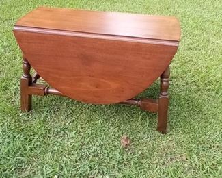 Lot Number:	256
Lead:	Small Vintage Drop Leaf Stand
Description:	solid walnut wood 18" tall; top w/o leaves- 27" by 11" NOTE: wood to hold up leaves is missing
