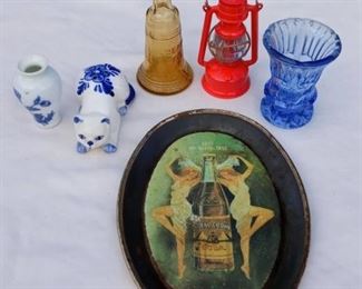 Lot Number:	264
Lead:	Group of Minature Items
Description:	- red lantern pencil sharpener 3" - blue & white porcelain cat salt shaker 3" - blue & white porcelain vase 2" - amber glass Liberty Bell 3" - blue glass toothpick holder 2.5" - Royal Crown Cola tray 6" by 4.5"
