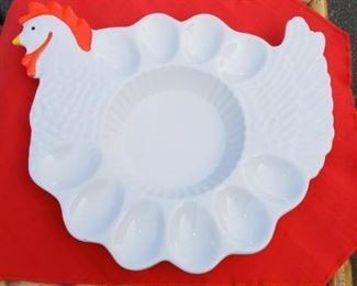 Lot Number:	263
Lead:	Hen Egg Dish
Description:	holds 10 eggs; center area for condiments 13" at widest part ***one tiny knick at edge of one egg
