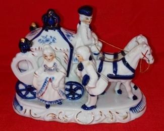 Lot Number:	271
Lead:	Vintage Porcelain Coach/ Horse Figurine
Description:	blue/white/ gold gilt 7.5" by 4" wide by 6" tall; all good
