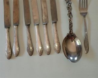 Lot Number:	285
Lead:	Lot of Vintage Silverware
Description:	6 Eickhorn Solingen Knives; Large Fancy Godinger serving spoon; Silhouette fork- J