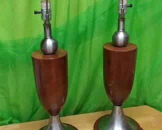Lot Number:	301
Lead:	Pair Mid Century Modern Lamps
Description:	23" tall to top of light socket by 8" diameter at base brown wood like portion has some scratches including one large scratch